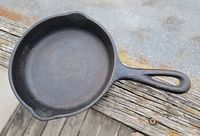 Top view of Wagner Ware #3 cast iron skillet showing cooking surface, handle, and pour spouts