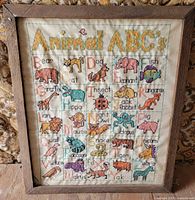 Full view of framed Animal ABC's cross stitch sampler