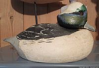 Left side view of carved and painted duck decoy