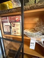 Boxed shelving area showing Ardalt plate stack wrapped in plastic