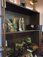 Front view of dark wood bookshelf with contents not included