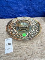top view of glazed stoneware chip and dip platter on fabric surface