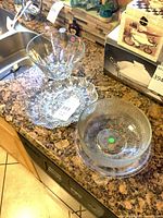 All four clear glass pieces on countertop