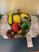 Entire lot with fruit in bowl and two clear dishes visible
