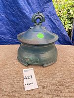 Full view of lidded jar showing glaze and form