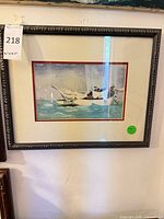 Framed watercolor painting showing sailboats, matting, frame detail and size reference tag visible