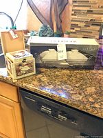 Godinger boxed baker set beside two decorative chef-print boxes