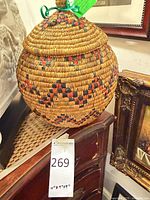 Full view of woven basket on furniture