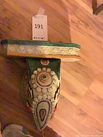 Top and side view showing painted surface and size tag