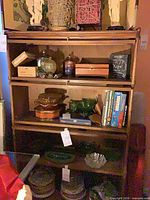 Full view of wooden barrister bookcase with three glass-front sections