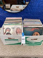 Two record storage boxes filled with LPs; front sleeves visible