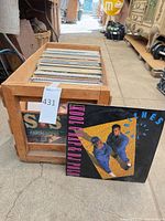 Wood crate filled with LP records, one jacket displayed in front