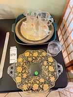 Overall lot showing glass platter, nested metal trays and pressed glass pieces