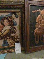 Needlepoint portrait and embossed metal relief side by side in frames