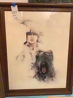 Full view of framed Sara Moon print showing woman and dog