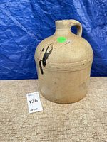 Full view of jug front showing glaze and form