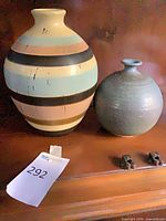 Both vases displayed side by side