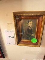 Full view of framed Victorian photograph with auction tag