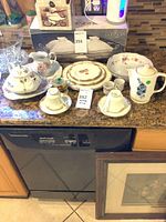 Group shot of all porcelain and ironstone pieces on countertop