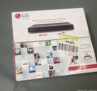 Front of box showing LG branding and picture of player