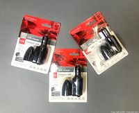 Front view of three identical sealed RCA charger packs