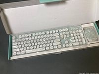 Keyboard and mouse sealed in factory plastic inside original box