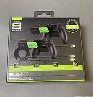 Front of Surge DualCharge kit box showing batteries inserted in controllers and cable