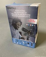 Retail box front showing Vivitar Podcasting Microphone Kit branding and contents list