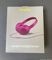 Front of sealed Heyday pink wired headphones retail box