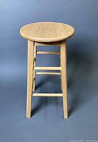 Full view of wooden stool front