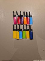 Front view of all 12 lighters showing assorted colors