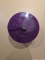 Top view of purple lid with turn knob