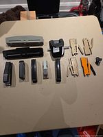 All punches, staplers, remover laid out