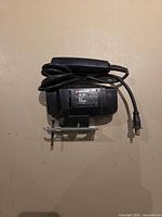Front view of Black & Decker jigsaw showing brand label, cord and installed blade