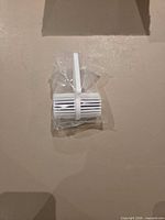 Single wrapped toilet bowl cleaner in white plastic cage