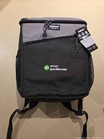 Front view of Igloo backpack cooler showing QuickBooks logo and tag