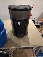 Front view of stainless steel countertop water cooler