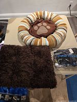 Round striped dog bed, rectangular shag bed, packaged Paw Five harness