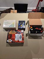 All four boxed items arranged on table
