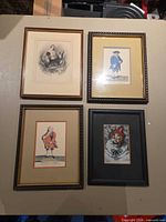 Group shot of all four framed artworks on tabletop
