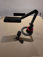 Lamp fully extended with AC adapter visible