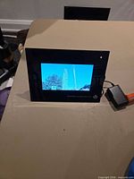 Front view of powered-on digital photo frame