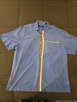 Front view of blue silk Nat Nast shirt showing stripe and pocket