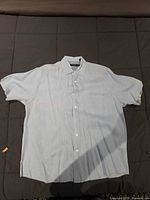 Full view of light blue short sleeve shirt flat