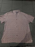 Front view of Nat Nast silk shirt laid flat showing overall pattern and condition