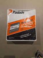 Front of Paslode RoundDrive nail box showing product branding