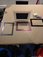 All lot contents: Philips digital picture frame, three magnetic trims, power adapter