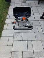 Front view of Scotts Turf Builder Pro Edgeguard broadcast spreader showing hopper and frame