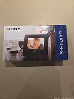 Front of sealed retail box showing Sony S-Frame DPF-D82