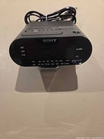 Front view showing Sony logo, LED display and alarm indicator